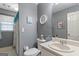 Bathroom features a toilet, sink, mirror and towels at 1917 Lake Ridge Ct, Jonesboro, GA 30236