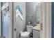 Half bath features modern fixtures, stylish décor, and a vanity at 1917 Lake Ridge Ct, Jonesboro, GA 30236