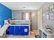 Bedroom with bunk bed, blue accent wall, and game theme at 1917 Lake Ridge Ct, Jonesboro, GA 30236