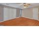 Spacious bedroom with wood floors and a large window, bathed in natural light at 1917 Lake Ridge Ct, Jonesboro, GA 30236