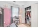 Bedroom featuring a vanity, a closet, and pink and white accents at 1917 Lake Ridge Ct, Jonesboro, GA 30236