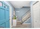 Bright foyer with blue door, staircase, decor and light gray flooring at 1917 Lake Ridge Ct, Jonesboro, GA 30236