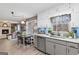 Lovely kitchen has modern appliances, backsplash, and an open view to the living room at 1917 Lake Ridge Ct, Jonesboro, GA 30236