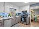 Charming kitchen with updated appliances, light countertops, and backyard view at 1917 Lake Ridge Ct, Jonesboro, GA 30236