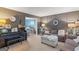 Comfortable living room with stylish decor, gray sofas, and a view into the dining area at 1917 Lake Ridge Ct, Jonesboro, GA 30236