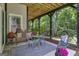 Comfortable back porch with a view, furnished with seating and stylish decor, ideal for relaxation and outdoor enjoyment at 120 Masters N Dr, Peachtree City, GA 30269