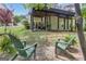 Inviting backyard space with patio, lawn, and relaxed seating area beneath a covered patio at 120 Masters N Dr, Peachtree City, GA 30269