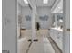 Bright bathroom with a large soaking tub, double vanity, and elegant decor for a spa-like experience at 120 Masters N Dr, Peachtree City, GA 30269