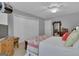 Comfortable bedroom features a closet, plush carpet, and warm lighting, perfect for relaxation and restful sleep at 120 Masters N Dr, Peachtree City, GA 30269
