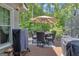 Spacious deck with outdoor dining area, furniture, and lush greenery in background at 120 Masters N Dr, Peachtree City, GA 30269