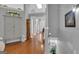 Bright foyer with hardwood floors, grand staircase, and decorative accents, creating an inviting entrance at 120 Masters N Dr, Peachtree City, GA 30269