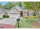 Inviting home with well-maintained lawn, mature landscaping, and a classic mailbox at 120 Masters N Dr, Peachtree City, GA 30269