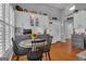 Eat-in kitchen features bright white cabinets, granite countertops and a lovely breakfast table at 120 Masters N Dr, Peachtree City, GA 30269