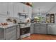 Modern kitchen offers stainless steel appliances, granite countertops, and a cozy breakfast nook at 120 Masters N Dr, Peachtree City, GA 30269