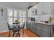 Bright eat-in kitchen features subway tile backsplash, granite countertops, and window with views at 120 Masters N Dr, Peachtree City, GA 30269