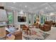 Relaxing living room with fireplace, TV, and a beautiful rug, perfect for entertaining or cozy evenings at 120 Masters N Dr, Peachtree City, GA 30269