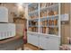Organized storage room with a bookcase, shelving units, and decor at 120 Masters N Dr, Peachtree City, GA 30269