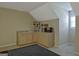 Basement snack bar with wooden cabinets, popcorn machine and mini-fridge at 100 Clydesdale Ct, Tyrone, GA 30290