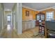 Open dining room featuring hardwood floors, custom cabinetry, and elegant trim work at 100 Clydesdale Ct, Tyrone, GA 30290