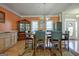 Dining room boasts lots of natural light, wood floors, and a furniture-style kitchen island at 100 Clydesdale Ct, Tyrone, GA 30290