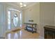Bright foyer features hardwood floors, an ornate console table, and a decorative front door at 100 Clydesdale Ct, Tyrone, GA 30290