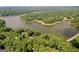 A high angle shows lakefront homes surrounded by verdant trees and tranquil waters at 127 Darwish Dr, Mcdonough, GA 30252