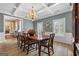 Sophisticated dining room featuring a large wood table, traditional decor, and ample natural light at 127 Darwish Dr, Mcdonough, GA 30252