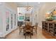 Bright dining room showcases hardwood floors and flows seamlessly into the living area at 127 Darwish Dr, Mcdonough, GA 30252