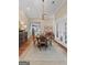 Stylish dining room adjacent to an open kitchen, perfect for entertaining and Gathering meals at 127 Darwish Dr, Mcdonough, GA 30252