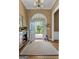 Gracious foyer with hardwood floors, a neutral rug, elegant furniture, and view of the front yard at 127 Darwish Dr, Mcdonough, GA 30252
