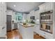 This eat-in kitchen boasts stainless appliances, granite countertops and an island with lots of counter space at 127 Darwish Dr, Mcdonough, GA 30252