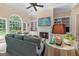 Bright living area with fireplace, expansive windows, and comfortable seating is great for relaxing at 127 Darwish Dr, Mcdonough, GA 30252