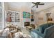 Inviting living room with fireplace, built-in bookshelves, and comfortable seating area at 127 Darwish Dr, Mcdonough, GA 30252