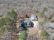 Bird's eye view of a house with a large detached garage surrounded by trees at 175 Laney Ct, Mcdonough, GA 30252