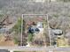 Aerial view of a charming house with a large detached garage and wooded lot at 175 Laney Ct, Mcdonough, GA 30252
