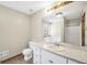 Bathroom showcasing a vanity and a large tub, offering relaxation and convenience at 175 Laney Ct, Mcdonough, GA 30252