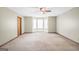 Bedroom with natural lighting from bay windows, carpeted floors, and ceiling fan at 175 Laney Ct, Mcdonough, GA 30252