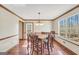 Bright dining room with a large window and an 8-chair dining set, perfect for Gathering gatherings at 175 Laney Ct, Mcdonough, GA 30252