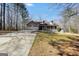Inviting home featuring a welcoming front porch, a two-car garage and manicured front lawn in a lovely neighborhood at 175 Laney Ct, Mcdonough, GA 30252