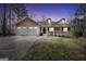 Inviting home featuring a welcoming front porch, a two-car garage and manicured front lawn in a lovely neighborhood at 175 Laney Ct, Mcdonough, GA 30252