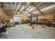 Spacious garage with high ceilings, featuring a lift and ample workshop space for car enthusiasts or DIY projects at 175 Laney Ct, Mcdonough, GA 30252