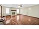 Bright living room with hardwood floors and a stone fireplace, creating a cozy and inviting atmosphere at 175 Laney Ct, Mcdonough, GA 30252