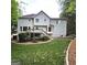 Backyard view of house with deck and landscaping with a walkway at 1008 Stonekirk Trce, Lawrenceville, GA 30043