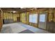 Unfinished basement with insulation on walls and a door to the exterior at 1008 Stonekirk Trce, Lawrenceville, GA 30043