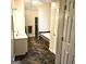 This bathroom features double sinks, a shower, and a jacuzzi tub at 1008 Stonekirk Trce, Lawrenceville, GA 30043