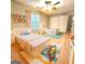 bedroom with beds, fun decor, built-in shelves, and plush rugs at 1008 Stonekirk Trce, Lawrenceville, GA 30043