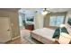 Well-lit bedroom with a large bed, wood-look flooring, and ample natural light at 1008 Stonekirk Trce, Lawrenceville, GA 30043