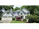 Charming two-story home with manicured lawn, a two-car garage and inviting front entrance at 1008 Stonekirk Trce, Lawrenceville, GA 30043