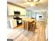 Modern kitchen with stainless steel appliances, center island, and wood floors at 1008 Stonekirk Trce, Lawrenceville, GA 30043