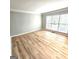 This expansive living room is illuminated by lots of natural light at 1008 Stonekirk Trce, Lawrenceville, GA 30043